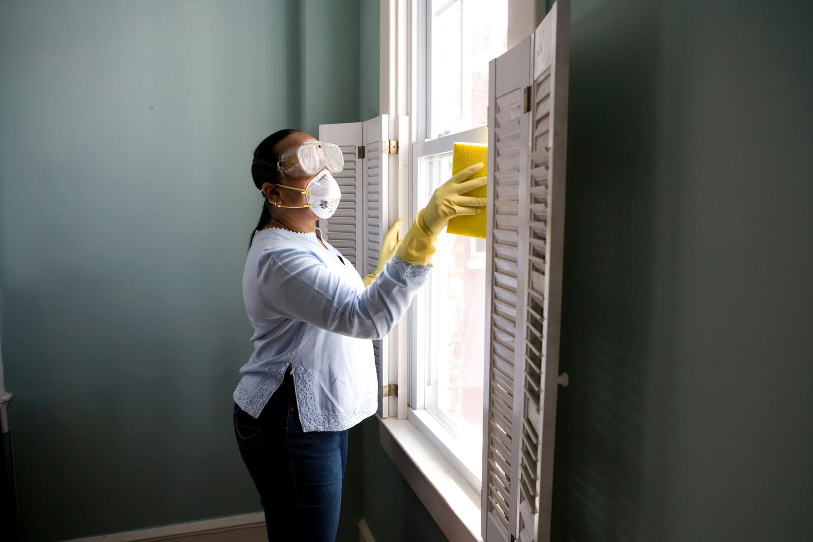 Professional house cleaner working in a home