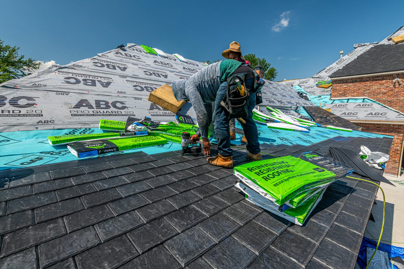 Roofing contractor working on a residential roof